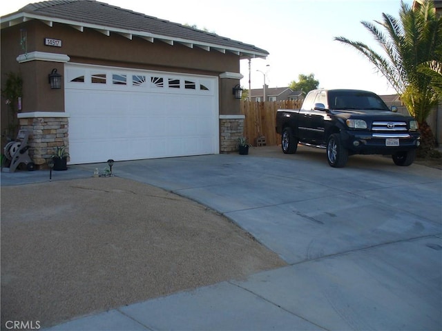 view of side of home featuring a garage