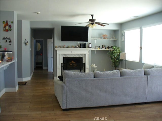 living room with ceiling fan and hardwood / wood-style flooring