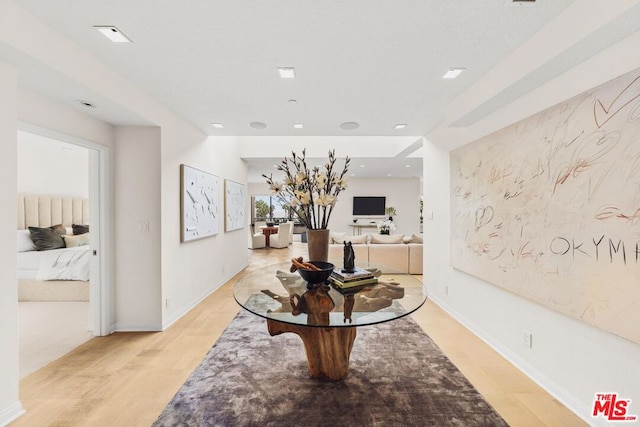 hall with light hardwood / wood-style floors