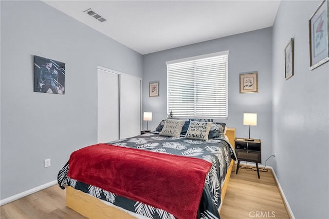 bedroom featuring a closet and hardwood / wood-style flooring