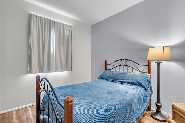 bedroom featuring wood-type flooring