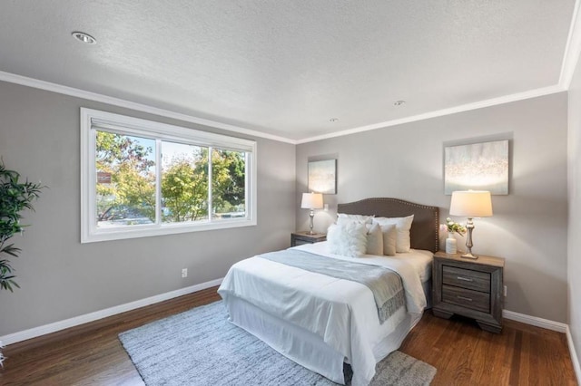 bedroom with dark hardwood / wood-style flooring, a textured ceiling, and ornamental molding