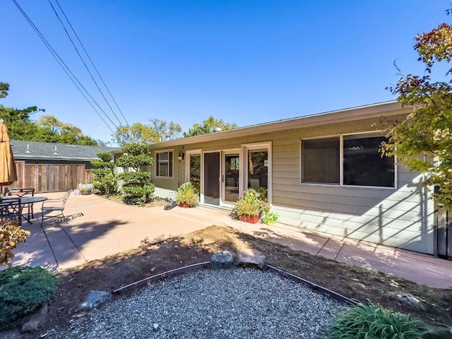 rear view of property featuring a patio area