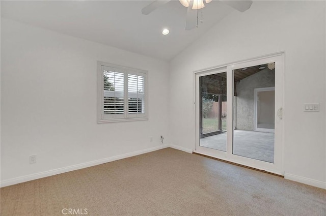 spare room with ceiling fan, lofted ceiling, and carpet floors