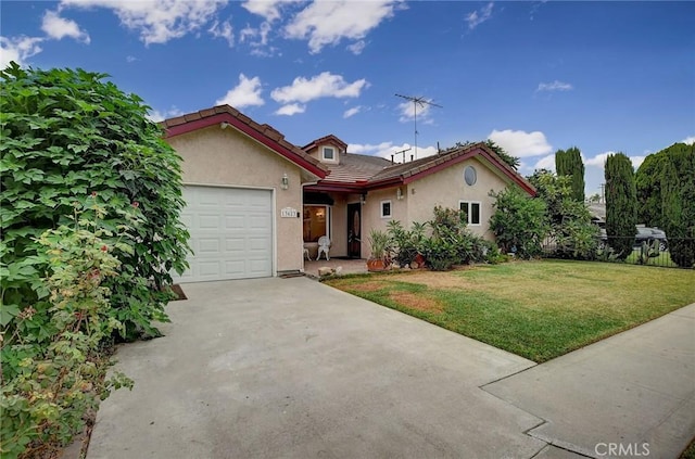 view of front of property featuring a garage and a front yard