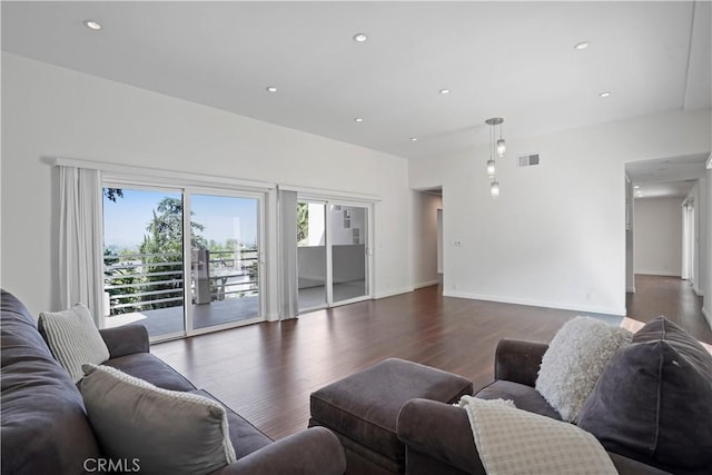 living room with dark hardwood / wood-style flooring