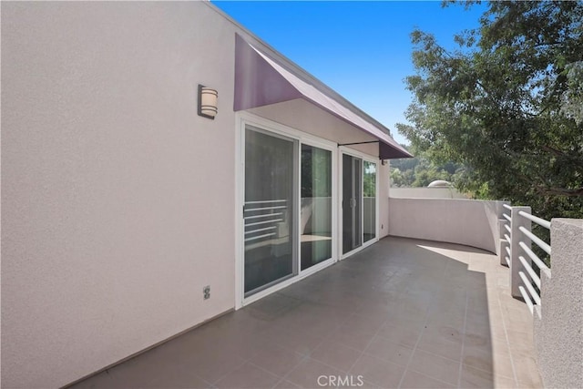 view of patio / terrace with a balcony