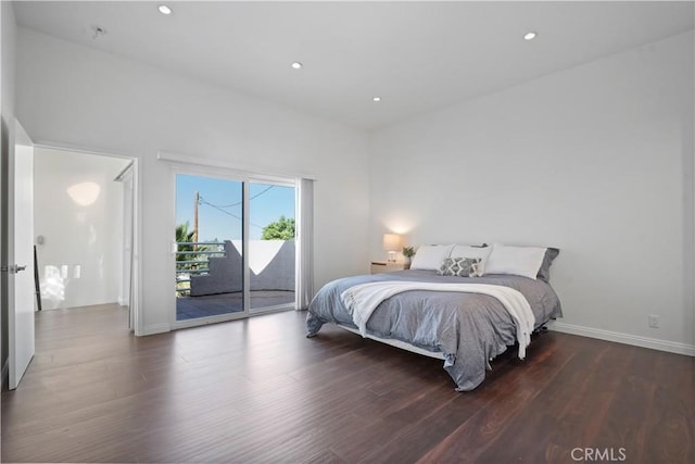 bedroom featuring wood-type flooring and access to outside