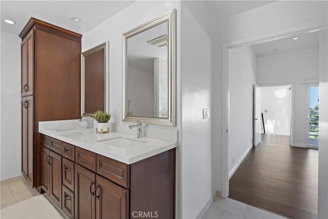 bathroom featuring hardwood / wood-style floors and vanity