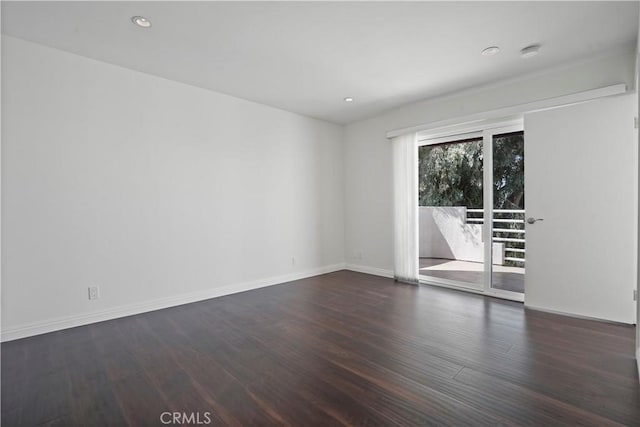 empty room featuring dark hardwood / wood-style floors