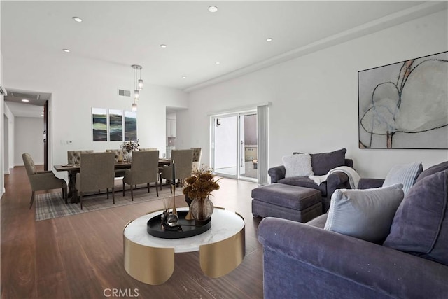 living room with hardwood / wood-style flooring and a healthy amount of sunlight