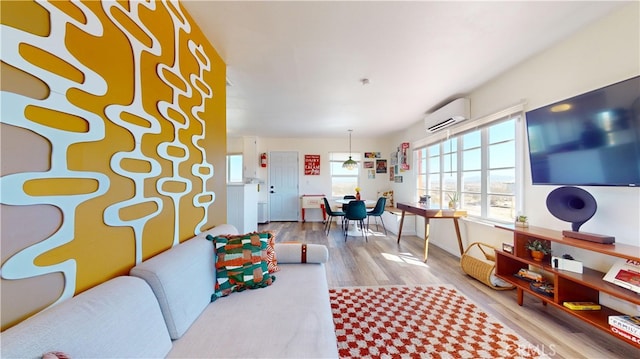 playroom with a wall mounted air conditioner and wood-type flooring