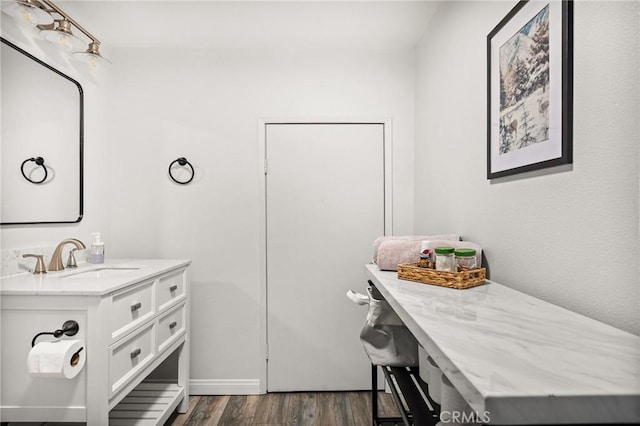 bathroom featuring vanity and wood finished floors
