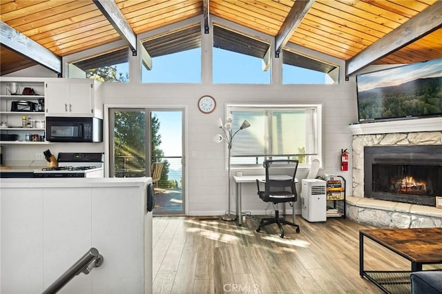 31600 City Creek Rd, Running Springs, CA 92382 - kitchen with black microwave, gas range gas stove, light wood-style floors, healthy amount of natural light, and wooden ceiling