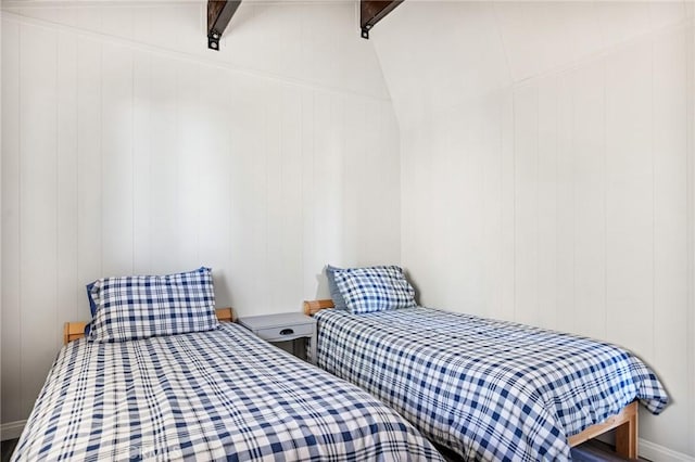 bedroom with beam ceiling