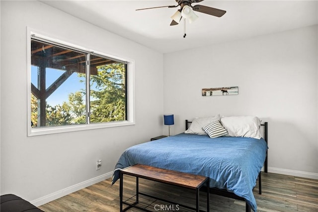 bedroom with wood-type flooring and ceiling fan