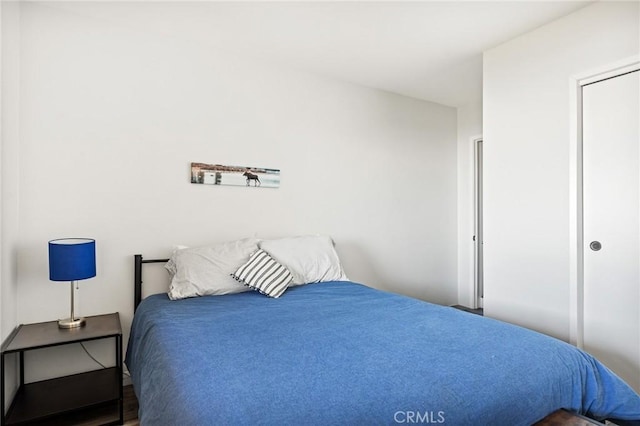 bedroom with wood-type flooring