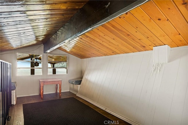 additional living space featuring wood finished floors, lofted ceiling with beams, and wooden ceiling