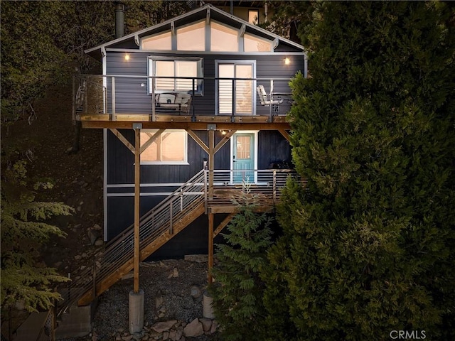 31600 City Creek Rd, Running Springs, CA 92382 - back of house at twilight featuring a balcony