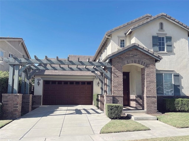 view of front of property featuring a garage and a pergola