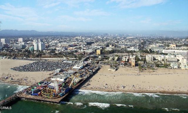 aerial view featuring a water view and a beach view