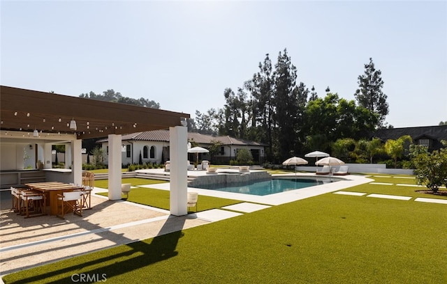 view of pool with a patio and a yard