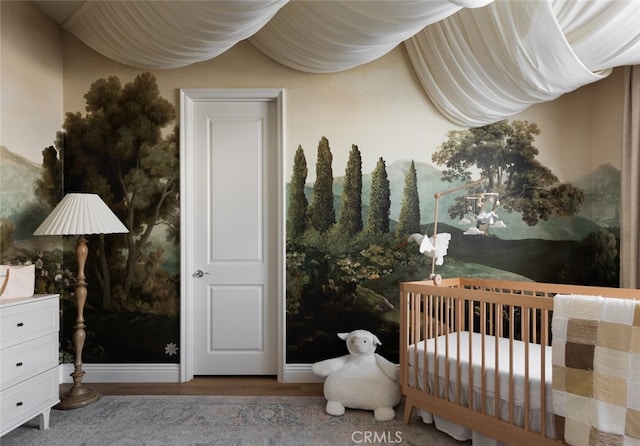 bedroom with a nursery area