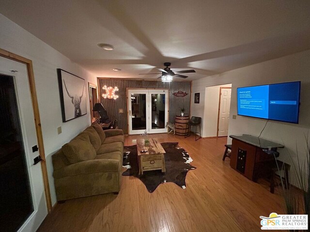 living room featuring ceiling fan and wood-type flooring