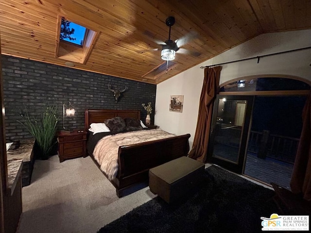 bedroom featuring wooden ceiling, brick wall, lofted ceiling with skylight, carpet floors, and ceiling fan