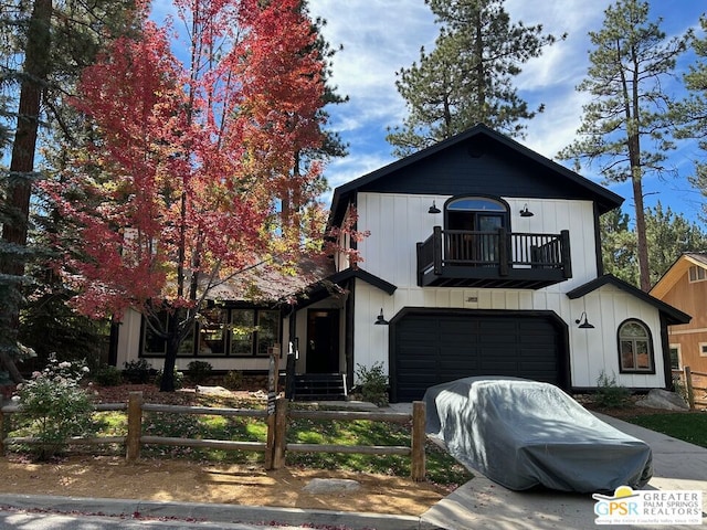 view of front of house featuring a balcony and a garage