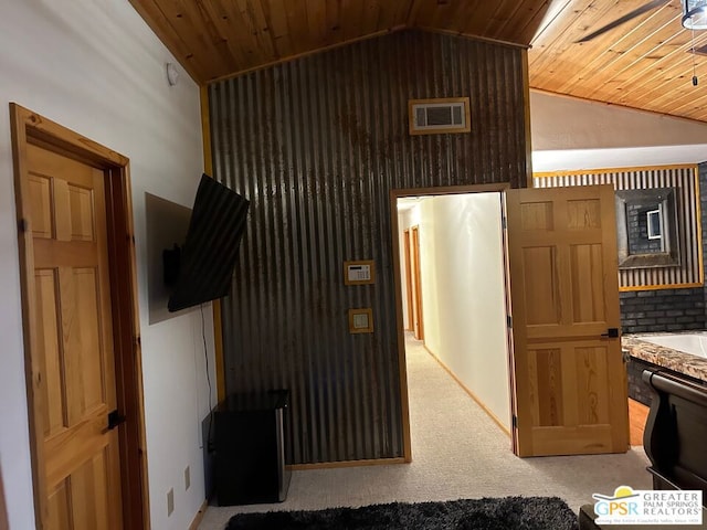 interior space featuring vaulted ceiling and wood ceiling