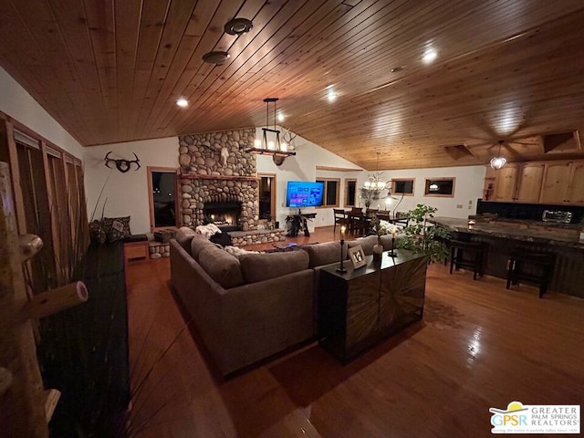 living room with lofted ceiling, dark wood-type flooring, wood ceiling, and a stone fireplace