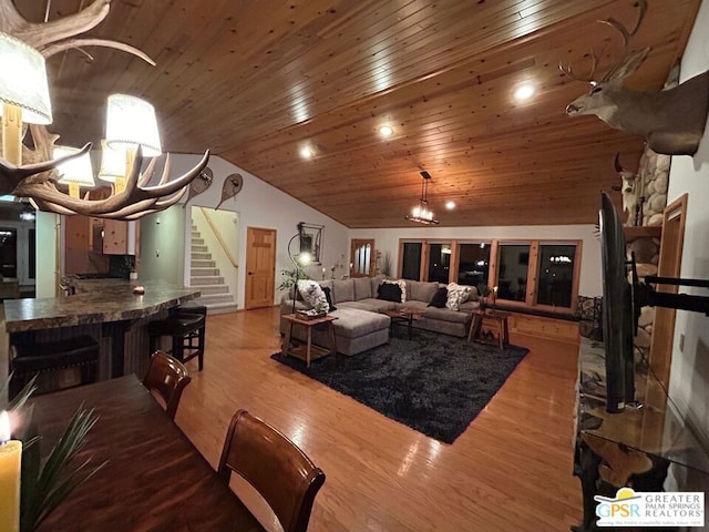 living room with wood ceiling, wood-type flooring, and vaulted ceiling