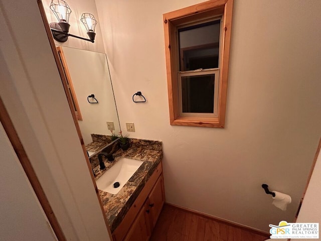 bathroom featuring vanity and hardwood / wood-style flooring