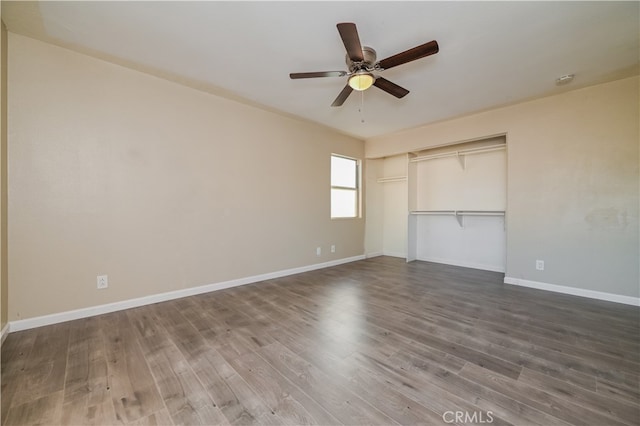 unfurnished bedroom with hardwood / wood-style floors, a closet, and ceiling fan