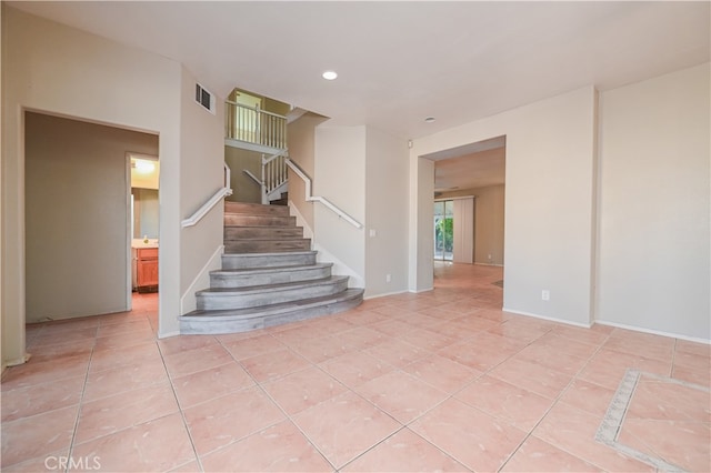 stairs with tile patterned flooring