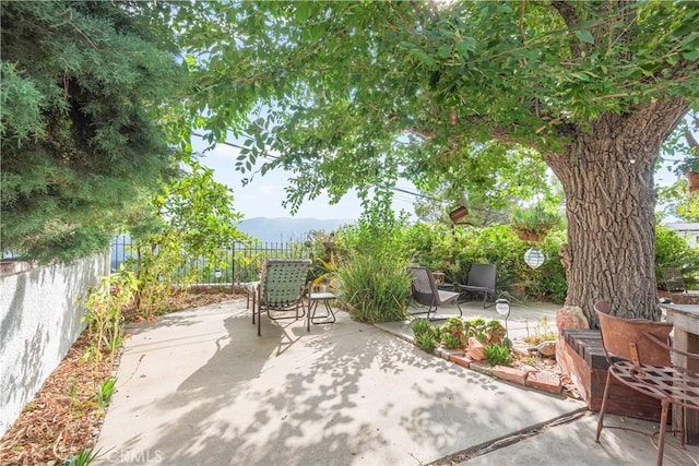 view of patio / terrace featuring a mountain view