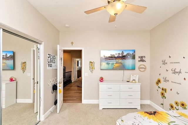 carpeted bedroom with ceiling fan