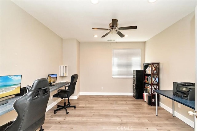 office area with ceiling fan and light hardwood / wood-style flooring