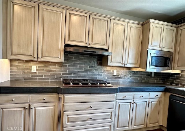 kitchen with appliances with stainless steel finishes and tasteful backsplash