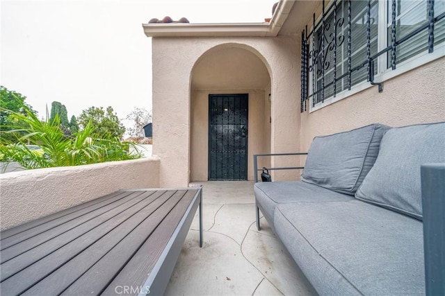 view of patio featuring a balcony