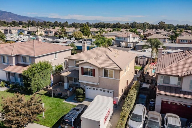 birds eye view of property with a mountain view