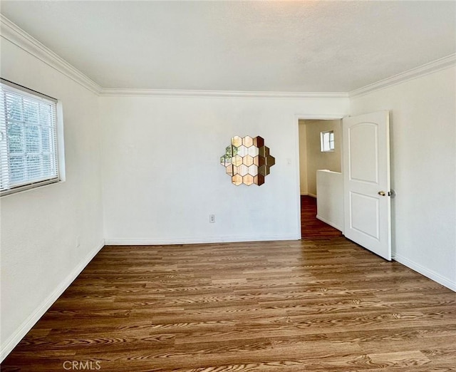 unfurnished room with dark hardwood / wood-style flooring and ornamental molding