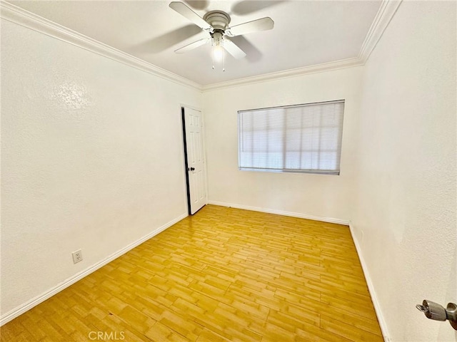 spare room featuring ceiling fan, light hardwood / wood-style floors, and ornamental molding