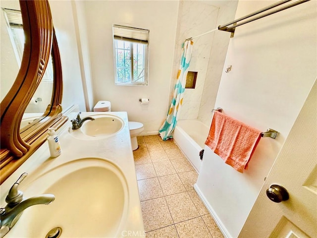 full bathroom with toilet, shower / bath combination with curtain, vanity, and tile patterned floors