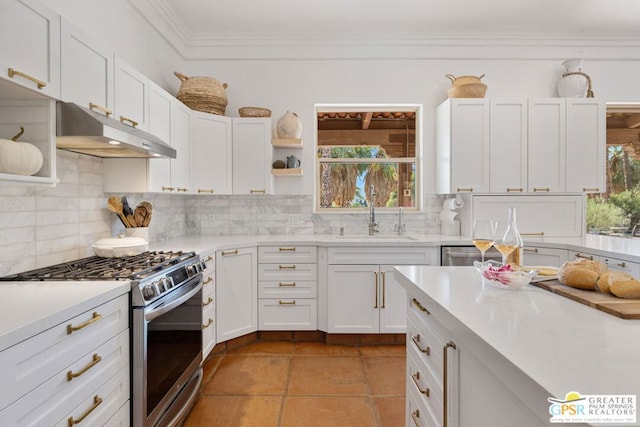 kitchen featuring plenty of natural light, gas stove, white cabinetry, and sink