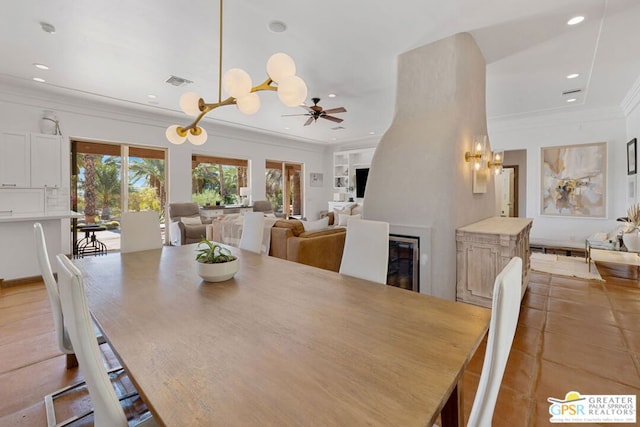 dining room featuring ceiling fan and ornamental molding