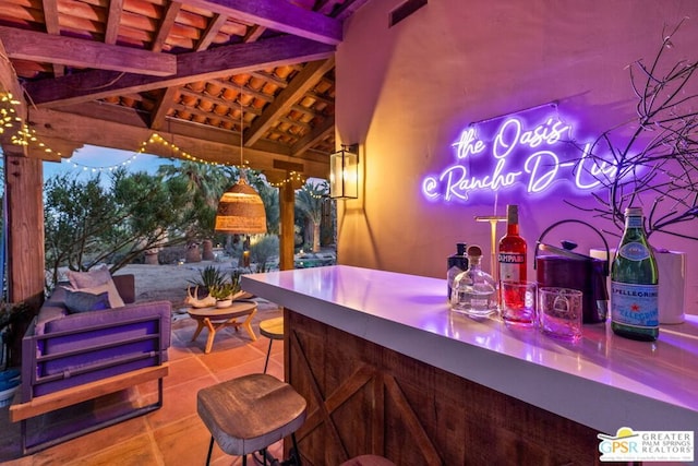 view of patio with a gazebo and an outdoor bar