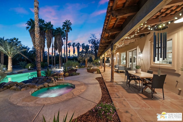 exterior space featuring a swimming pool with hot tub