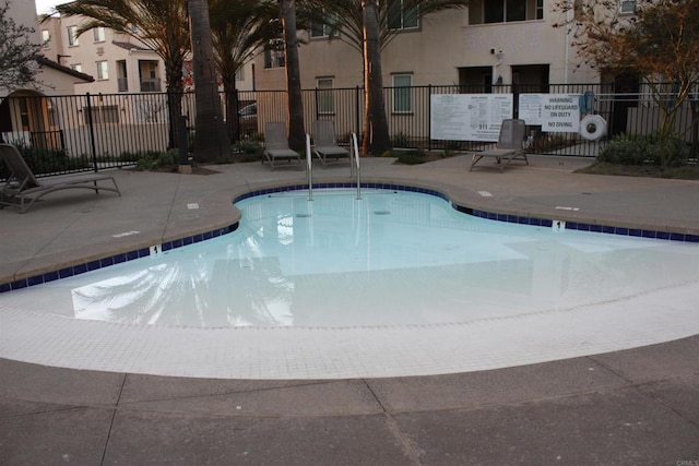 view of swimming pool with a patio